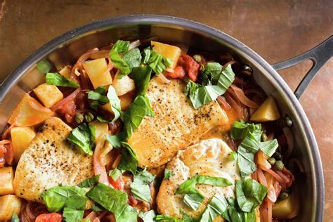 Sicilian swordfish cooks gently in rustic tomato-caper sauce